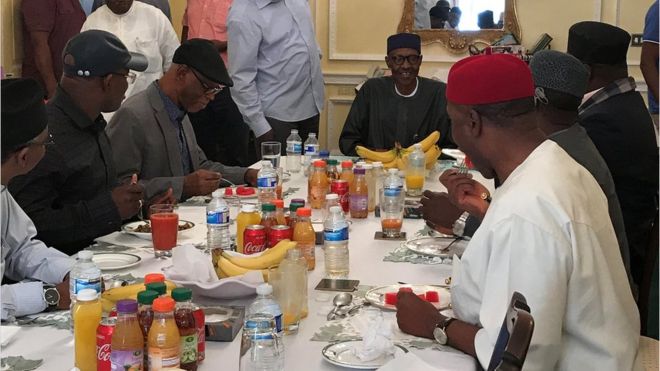 Nigeria's President Muhammadu Buhari (centre) having lunch in Abuja House in London