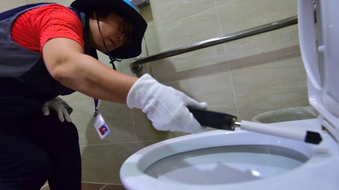 Seoul - checking toilet for hidden camera