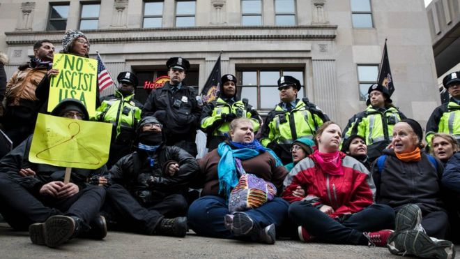 Protesters linked arms in the street on Inauguration Day