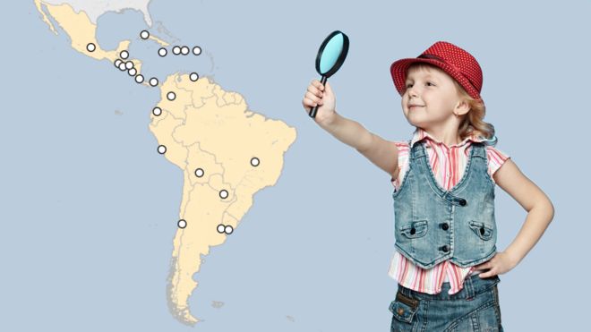 Mapa y niña con lupa.
