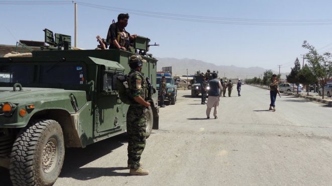 Afghan security officials secure the roads leading to the scene of suicide bomb blasts in Paktia, Afghanistan, 03 August 2018