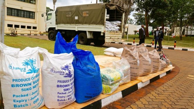 Bags of impounded sugar with truck in background