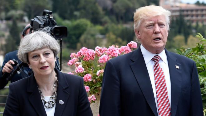 Britain"s Prime Minister Theresa May, US President Donald Trump and German Chancellor Angela Merkel arrive to watch an Italian flying squadron during the Summit of the Heads of State and of Government of the G7, the group of most industrialized economies, plus the European Union, on May 26, 2017