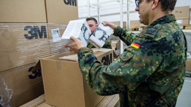 German soldiers unpack boxes of FFP2 masks on 1 April, 2020