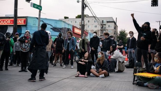 A rally in a district taken over by protesters in Seattle