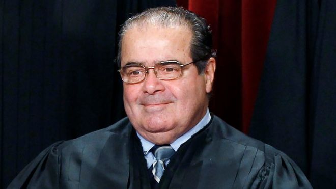 U.S. Supreme Court Justice Antonin Scalia is seen during a group portrait in the East Conference Room at the Supreme Court Building in Washington, in this file photo taken October 8, 2010