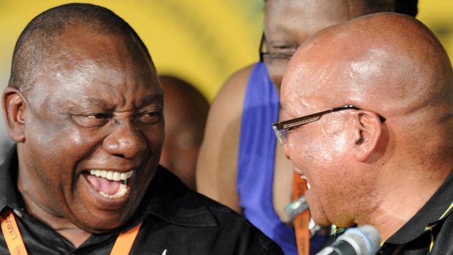 Newly elected deputy president of the African National Congress (ANC) Cyril Ramaphosa (L) talks with South African President and new reelected ANC president Jacob Zuma during the 53 rd National Conference of the ANC on December 18, 2012 in Bloemfontein.