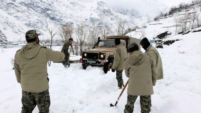Rescue workers trying to reach the avalanche-hit areas in Chitral, Pakistan