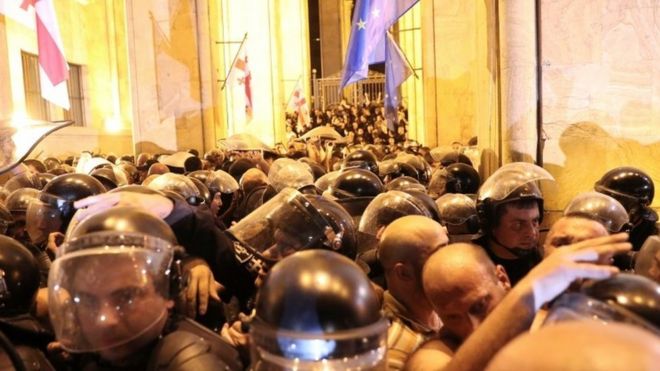 Police clash with protesters at a rally in Georgia