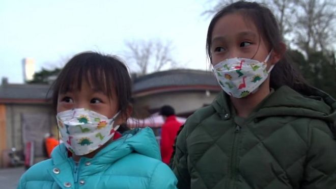 Two children wearing masks in Beijing