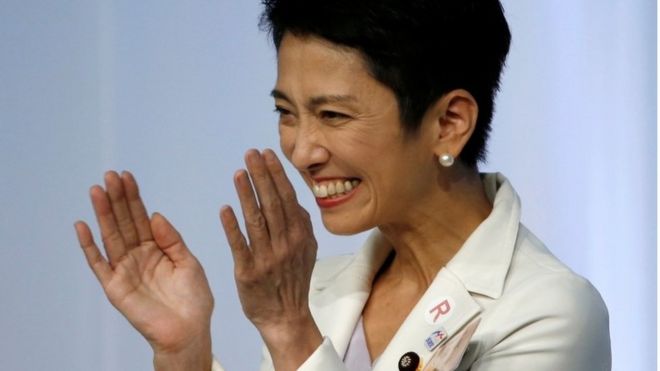 Japan's main opposition Democratic Party's new leader Renho (L) smiles after she was elected as the party leader at the party plenary meeting in Tokyo, Japan September 15, 2016.