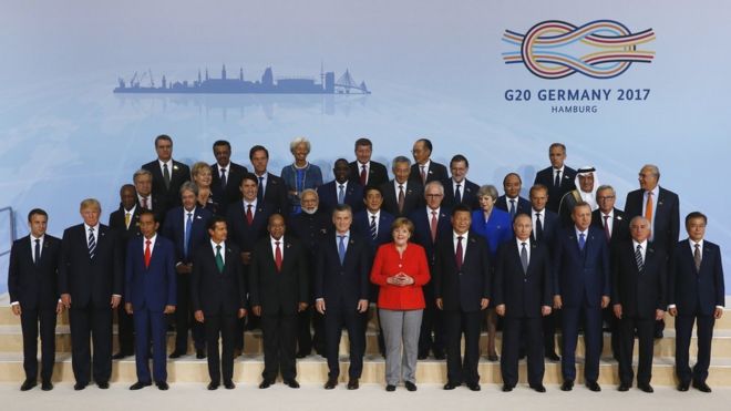 International leaders attend the group photo on the first day of the G20 economic summit in Hamburg, Germany, 7 July 2017