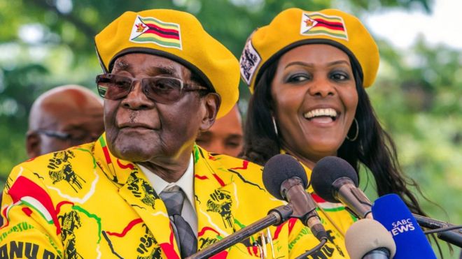 Zimbabwe's President Robert Mugabe addressing party members and supporters with Grace Mugabe (R) November 8, 2017