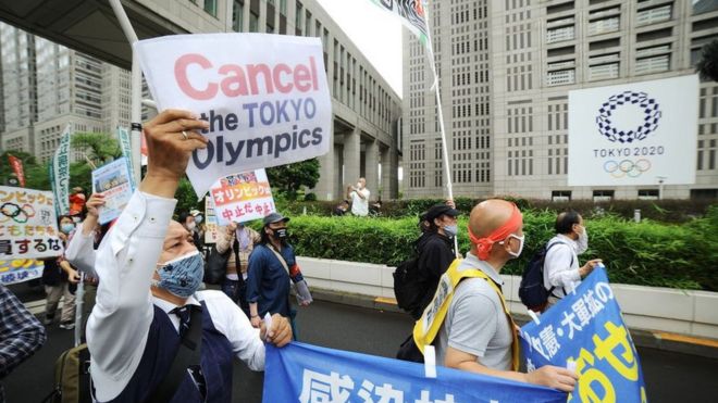 People stage a demonstration against Tokyo Olympics in front of the Tokyo Metropolitan Government in Tokyo, Japan on June 6, 2021.