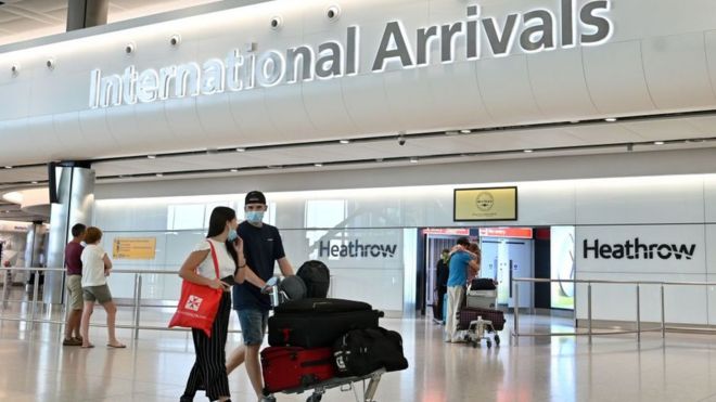 Passengers arrive at London Heathrow airport