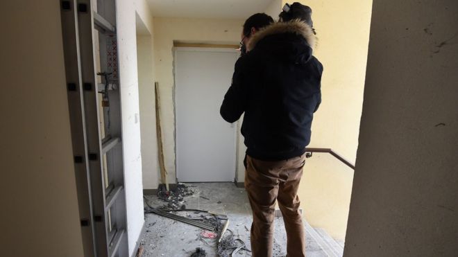 A journalist films debris outside the flat in Montpellier, 10 February