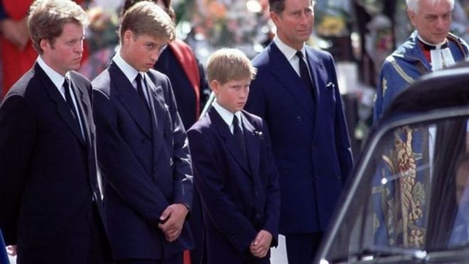 Prince Harry standing between his brother and father at Diana's funeral