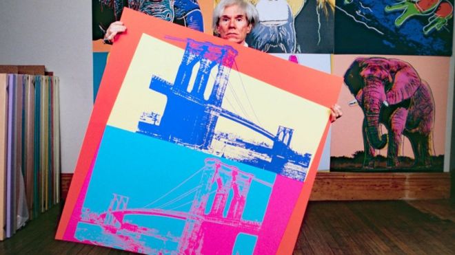 American pop artist Andy Warhol in his studio in New York in 1983.