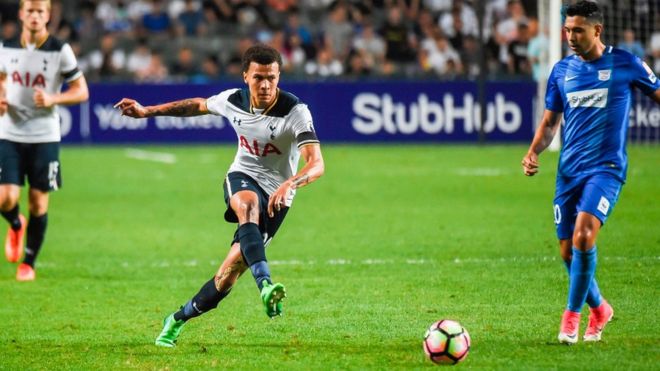 Tottenham Hotspur's English midfielder Dele Alli (C) kicks the ball during the friendly football match between Tottenham Hotspurs and Kitchee FC