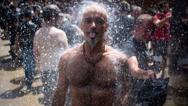 Image shows man cooling off