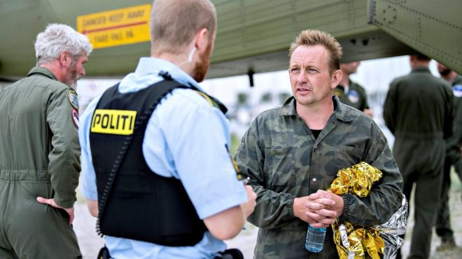 Submarine owner and inventor Peter Madsen speaks to police