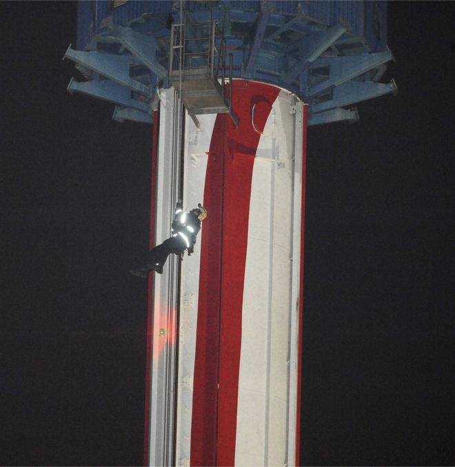 Orange County firefighters work to rescue Knott"s Berry Farm patrons who were stuck on a ride 30 December 2016, in Buena Park, California