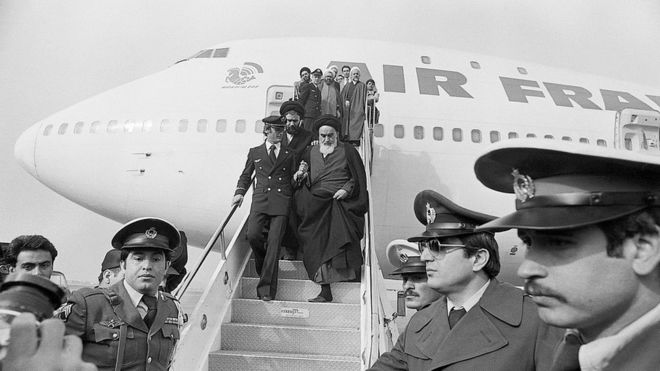Ayatollah Khomeini and close companions getting off a plane