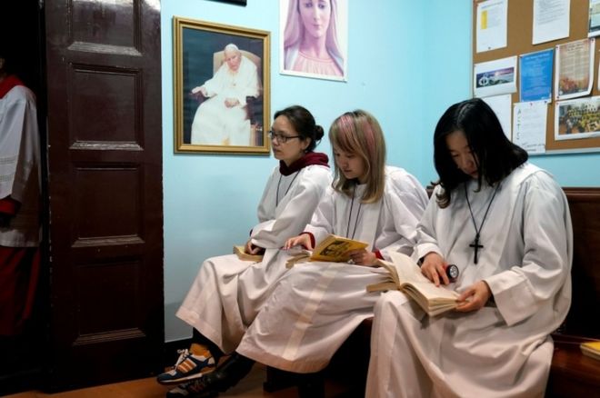 Chinese Catholics attend the Easter Vigil at a Catholic church in Shanghai, China March 31, 2018.