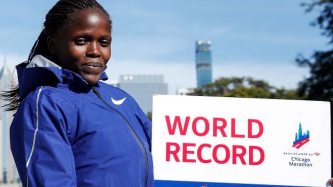 Kenya's Brigid Kosgei smiles after winning the women's 2019 Chicago Marathon - 13 October 2019