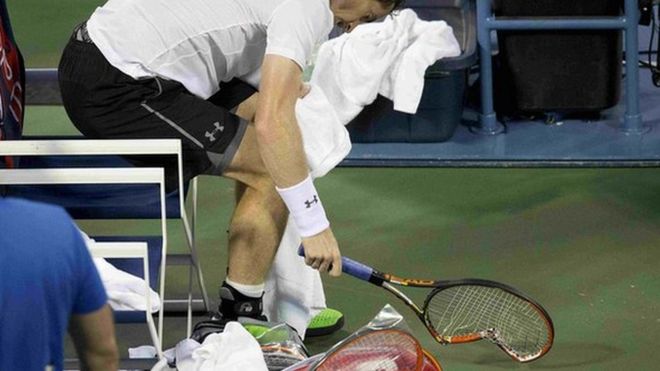 Andy Murray smashes his racquet