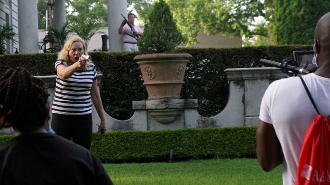 Patricia McCloskey pointing a weapon at protesters outside her home in St Louis in June