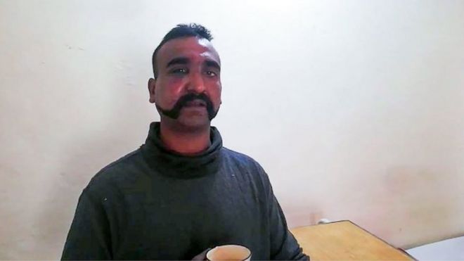 In this handout photograph released by Pakistan"s Inter Services Public Relations (ISPR) on February 27, 2019, shows captured Indian pilot looking on as holding a cup of tea in the custody of Pakistani forces in an undisclosed location