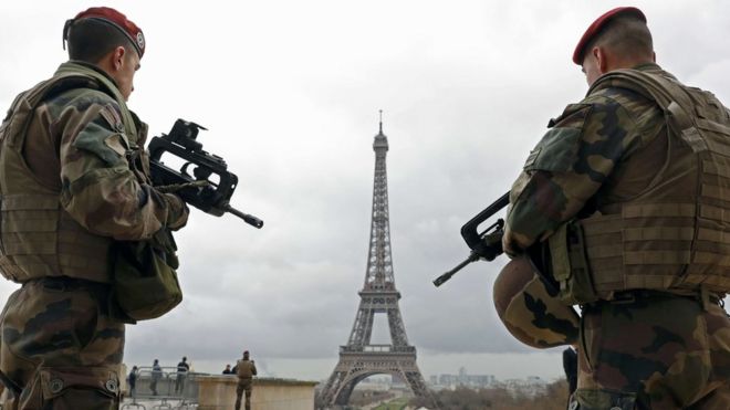 Soldiers patrol near the Eiffel Tower