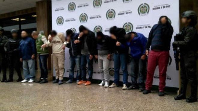 Handout picture by the Colombian Police showing the suspects with their faces blurred