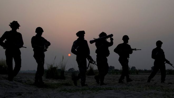 Indian army soldiers patrol near the highly militarized Line of Control dividing Kashmir between India and Pakistan, in Pallanwal sector, about 75 kilometers from Jammu, India, Tuesday, Oct. 4, 2016