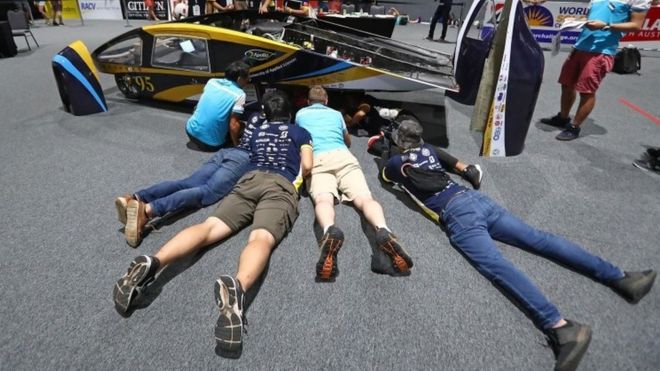 Team members look on as Apollo VIII, the car from Taiwan's National Kaohsiung University of Applied Sciences