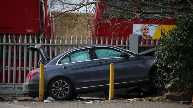 A car crashed into a fence