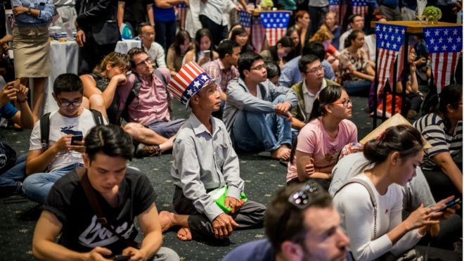 People watch live election results hosted by the United States Consulate General at a convention center on November 9, 2016 in Ho Chi Minh City, Vietnam. Donald Trump"s stunning performance in the US presidential election triggered shock and angst in Asia, where observers fretted over the implications for everything from trade to human rights and climate change.