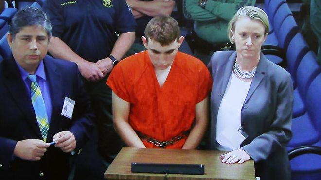 Nikolas Cruz, 19, is seen on a screen during a bond hearing in front of Broward Judge Kim Mollica at the Broward County Courthouse, 15 February 2018
