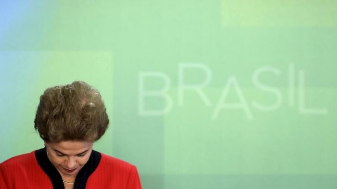 President Dilma Rousseff reacts during a signing ceremony of a deal between mining company Samarco and its owners, BHP Billiton and Vale SA, with the Brazilian government at the Planalto Palace in Brasilia, Brazil, March 2, 201