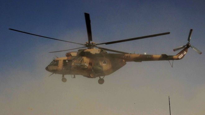 An Afghan helicopter takes troops to the front lines