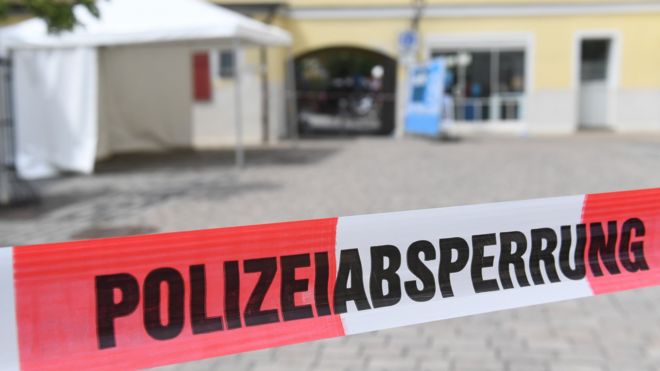 Police tape blocks access to the area in central Ansbach where the explosion took place (25 July 2016)