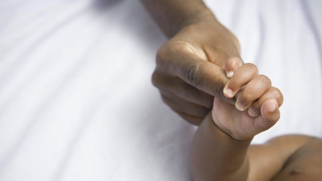 Woman hand hold baby hand