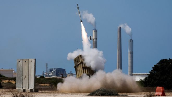 An Israeli Iron Dome missile defence system battery fires an interceptor missile after a rocket is launched from the Gaza Strip by Palestinian militants towards Israel on 7 August 2022