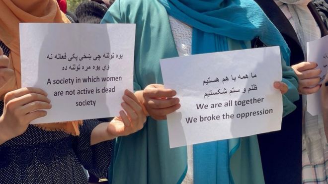 "We are all together, we broke the oppression" - signs at protest in Kabul