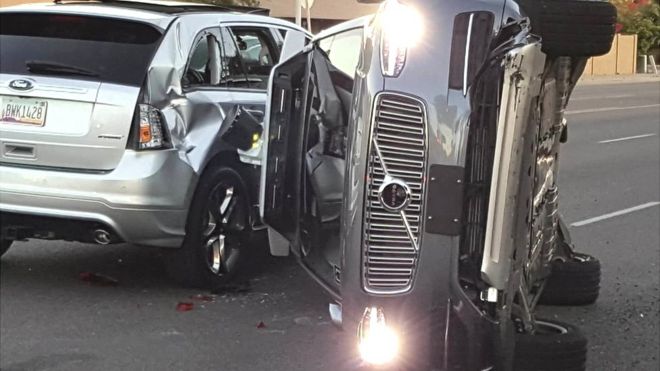 A self-driven Volvo SUV owned and operated by Uber Technologies Inc. is flipped on its side after a collision in Tempe, Arizona, U.S. on March 24, 2017.