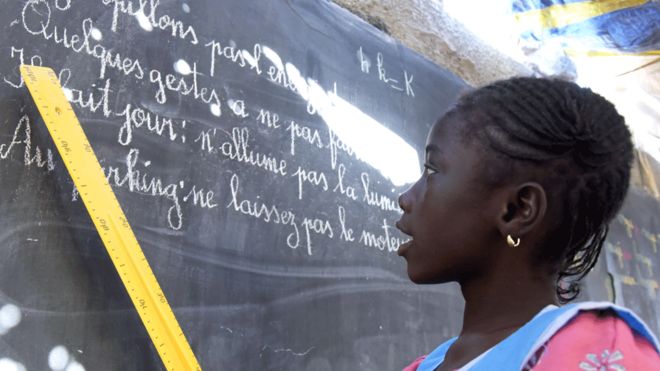 A pupil stands in front of the blackboard during class in Tivaouane, near Dakar, Senegal - 31 January 2018