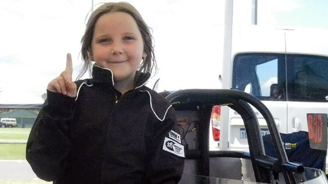 Handout photo from Junior Dragster Australia taken on October 14, 2017 shows eight-year-old Anita Board next to her junior dragster racing car.