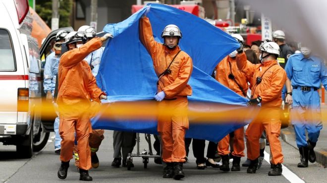 Rescue workers operate at the site where sixteen people were injured in a suspected stabbing by a man, in Kawasaki, Japan, 28 May 2019