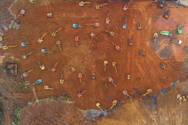 Diggers in Wuhan at site for new field hospital